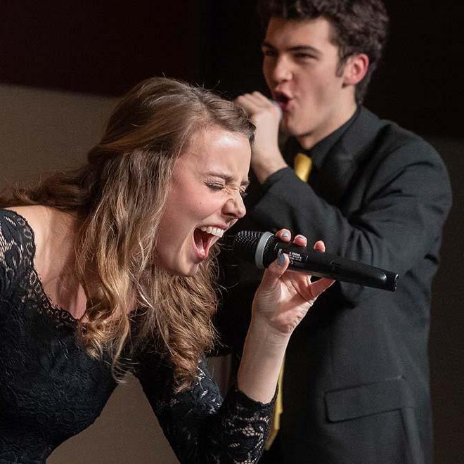 Female singer performing as part of a very popular and award-winning Vocal Jazz group at the University of Mary.