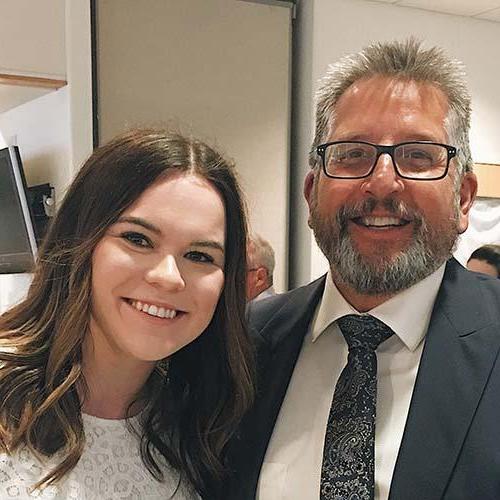 Dean of the School of Business Karel Sovak with Year-round Campus student Karly Palczewski.